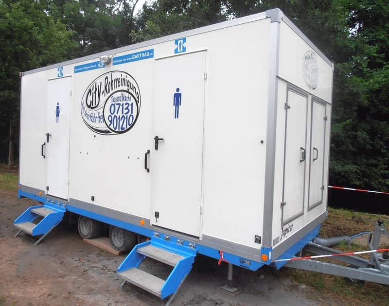 Event portable restroom cluster in Eagan, MN: a portable restroom in service at an outdoor community festival