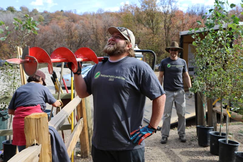 Portable restroom rental in Eagan, MN: an open outdoor work site with crews and site facilities in place